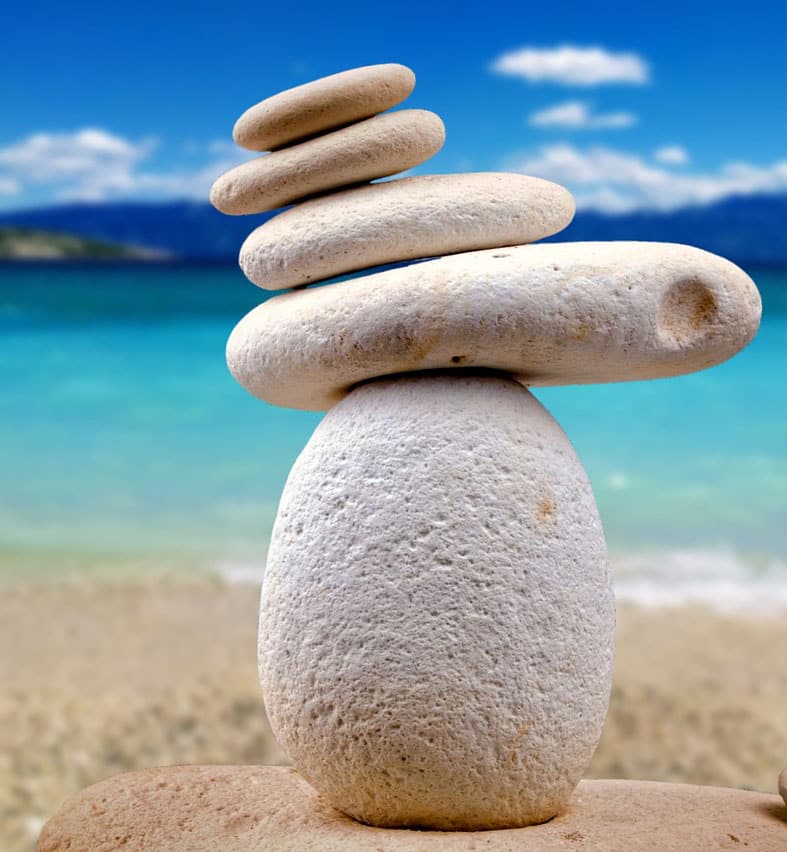 Photo of zen stacked rocks to represent a relaxed therapy environment for teens struggling with mental health