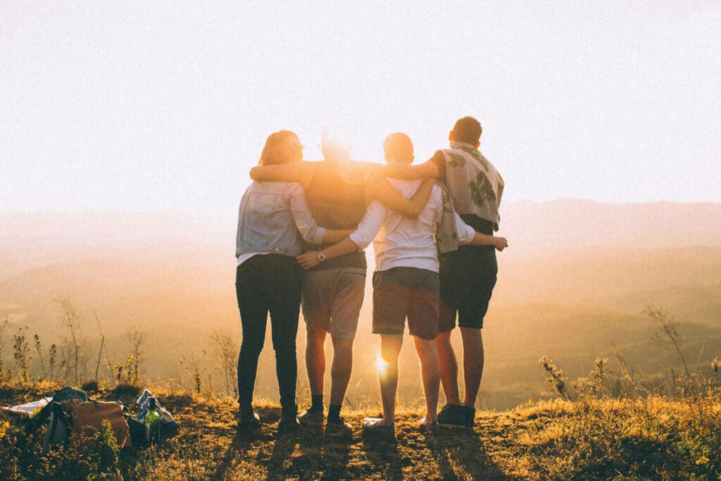 Photo of a teen with family support surrounding